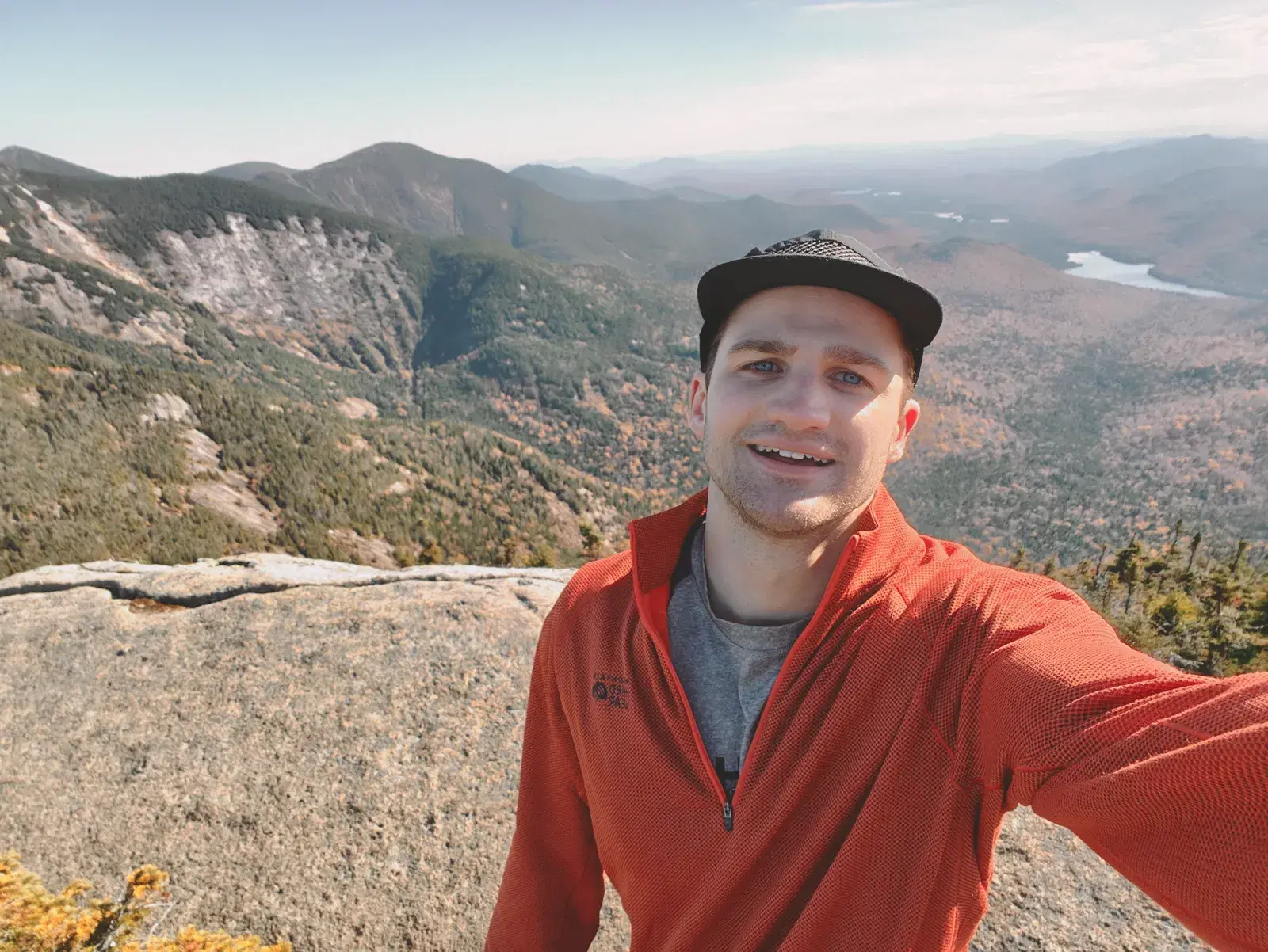 Everett McIntire outdoors in a mountain landscape